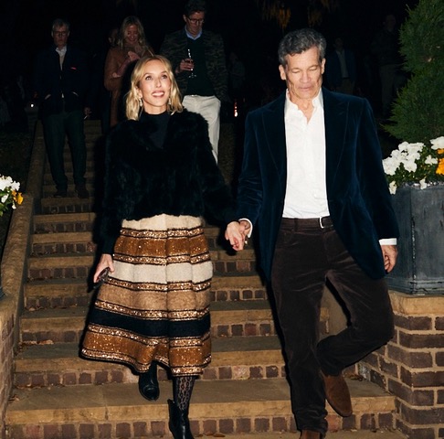Sarah Woodhead Bacon and husband Louis Bacon walk down stairs